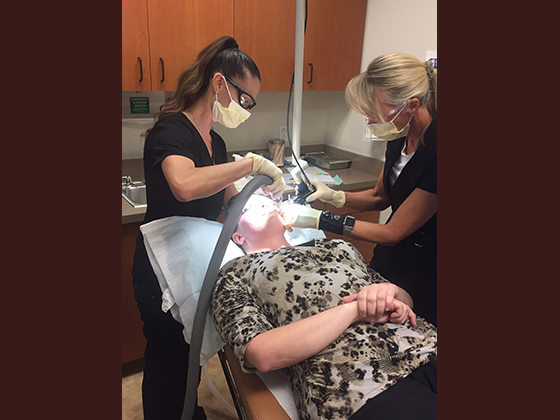 Ironwood Dermatology — patient receiving laser treatment